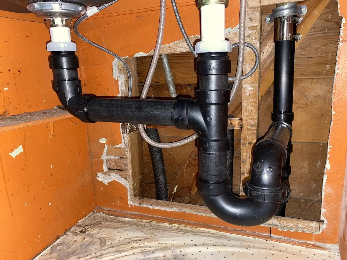 Professional Garbage Disposal Repair equipment and tools on the job in Deephaven